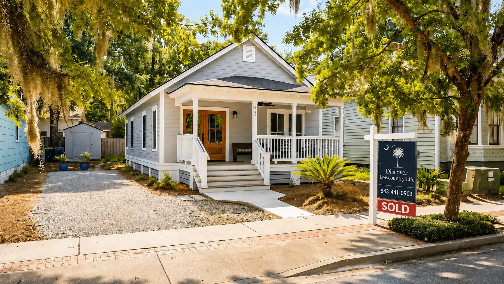 Discover Lowcountry Life sold sign in front of a charming Lowcountry cottage home